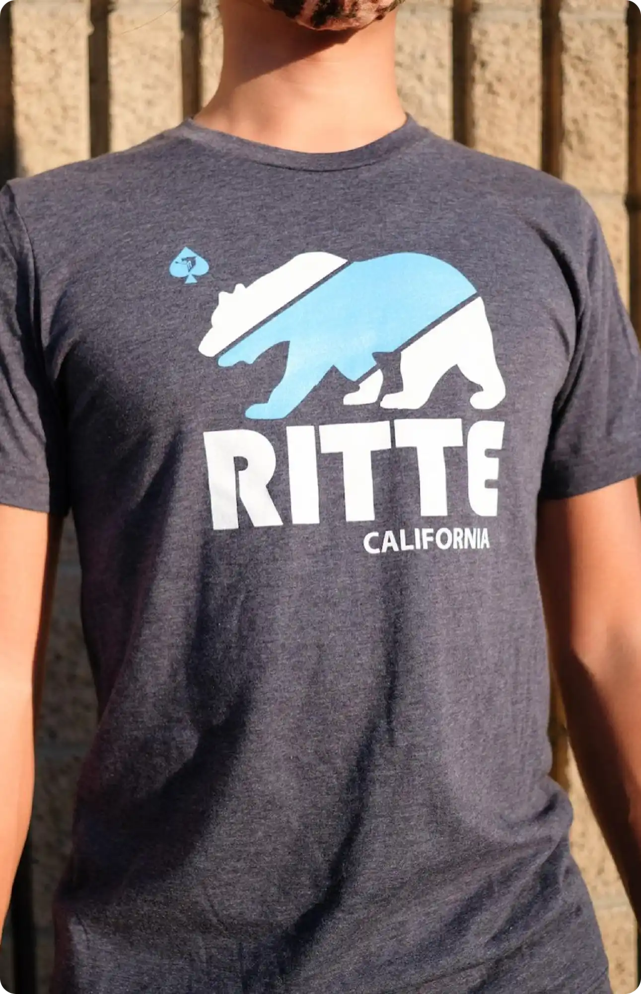 Gray t-shirt featuring a blue bear design with ’RITTE CALIFORNIA’ text.