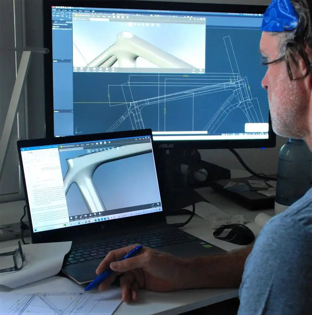 A bicycle frame design being modeled in CAD software.