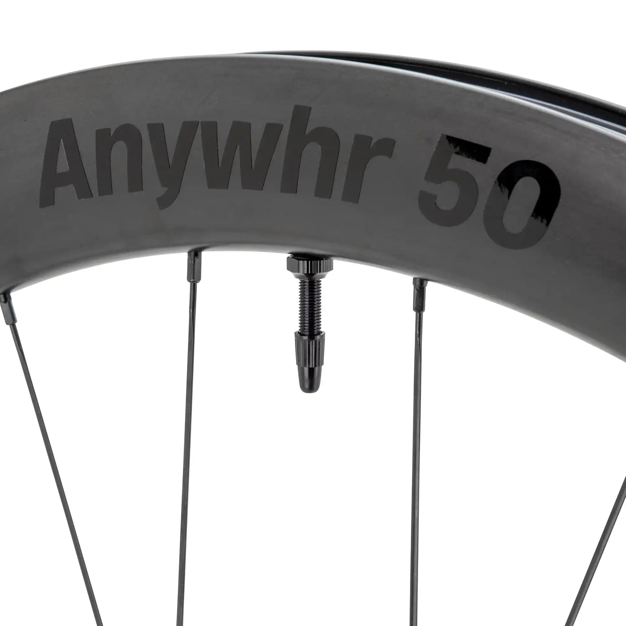 Bicycle wheel rim with ’Anywhr 50’’ text visible on its surface.