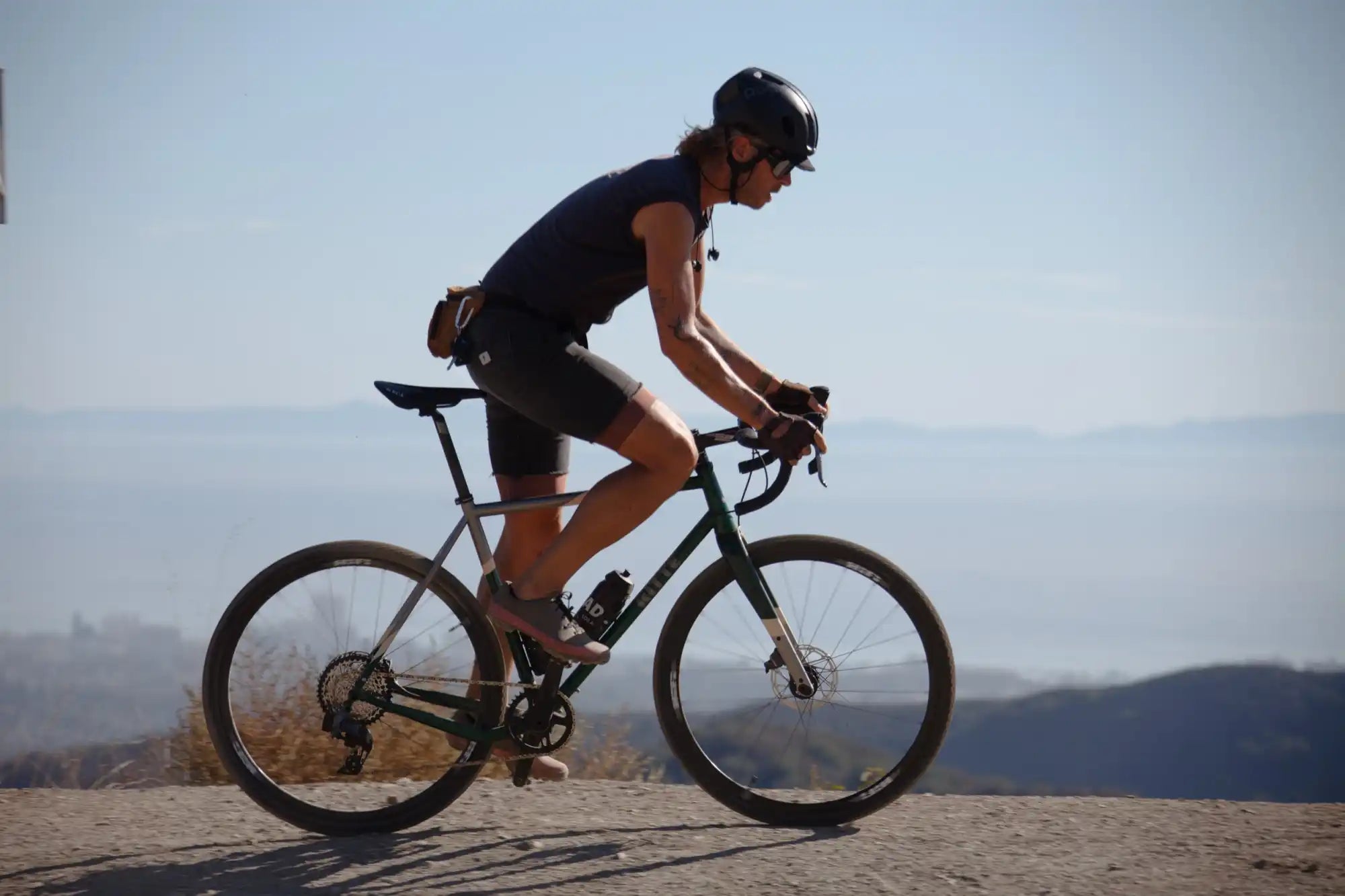 Cyclist riding a mountain bike on rocky terrain.