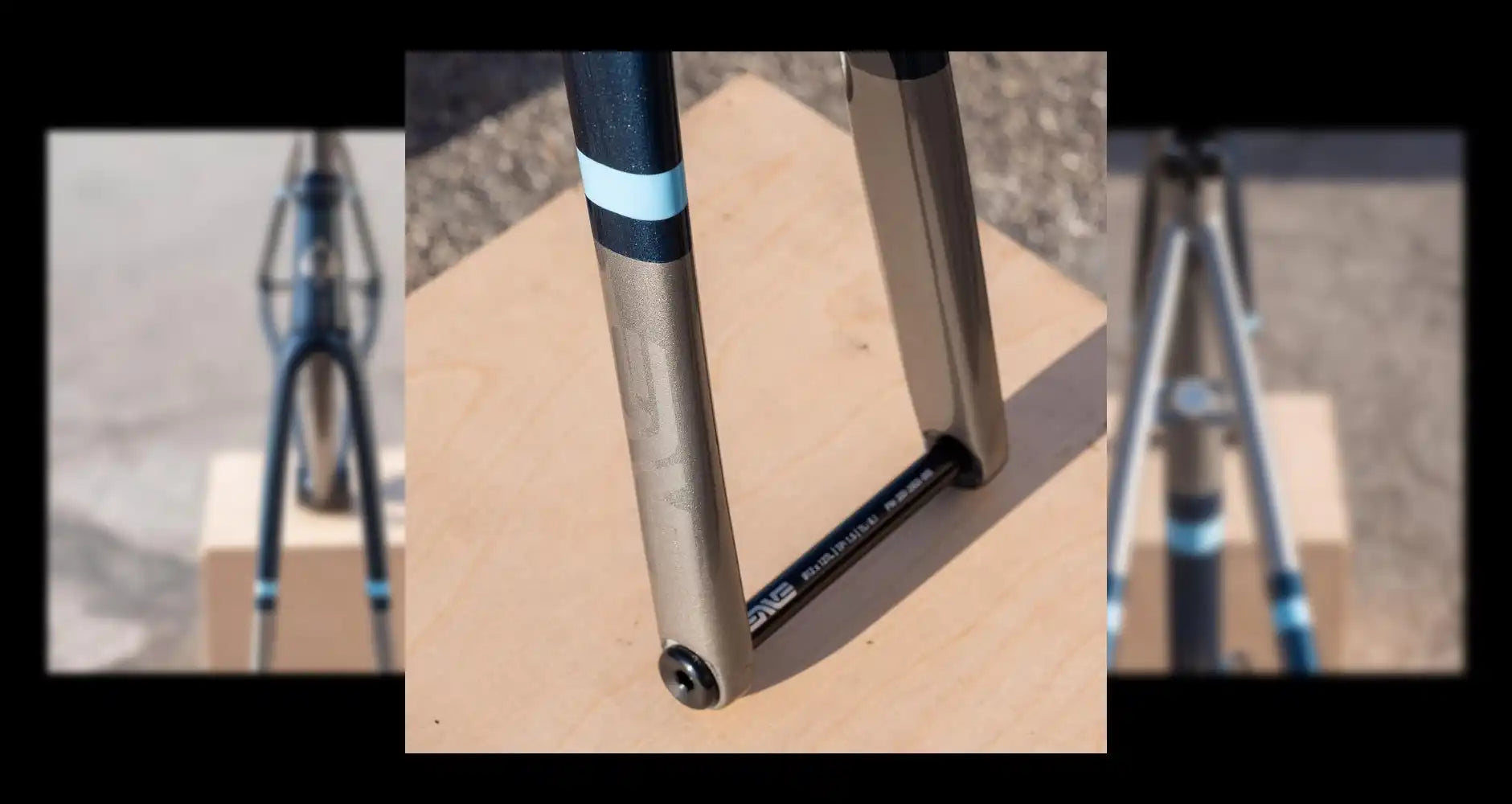 Metal bicycle fork with blue accents.