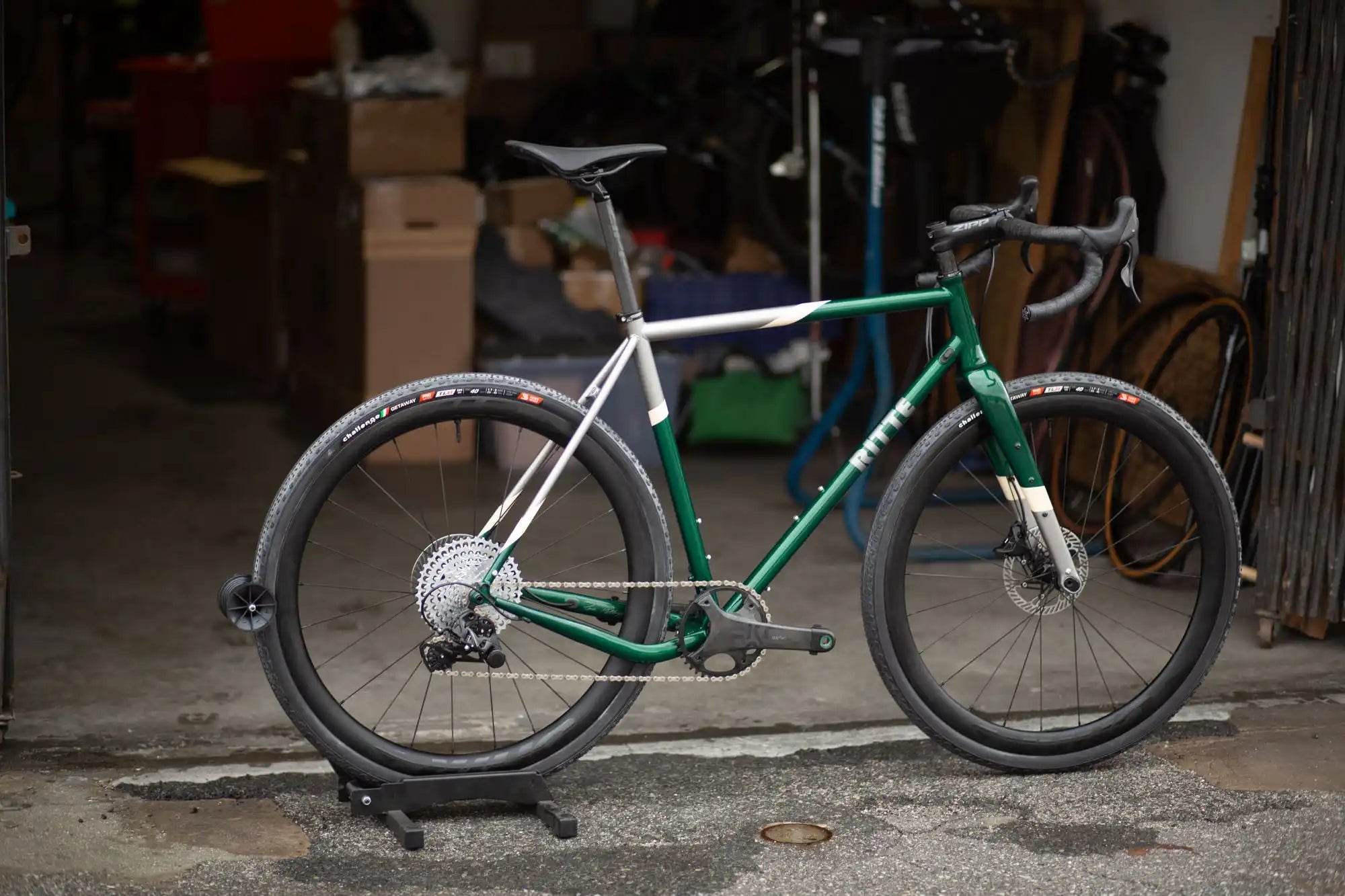 Modern road bike with a green and silver frame and disc brakes.