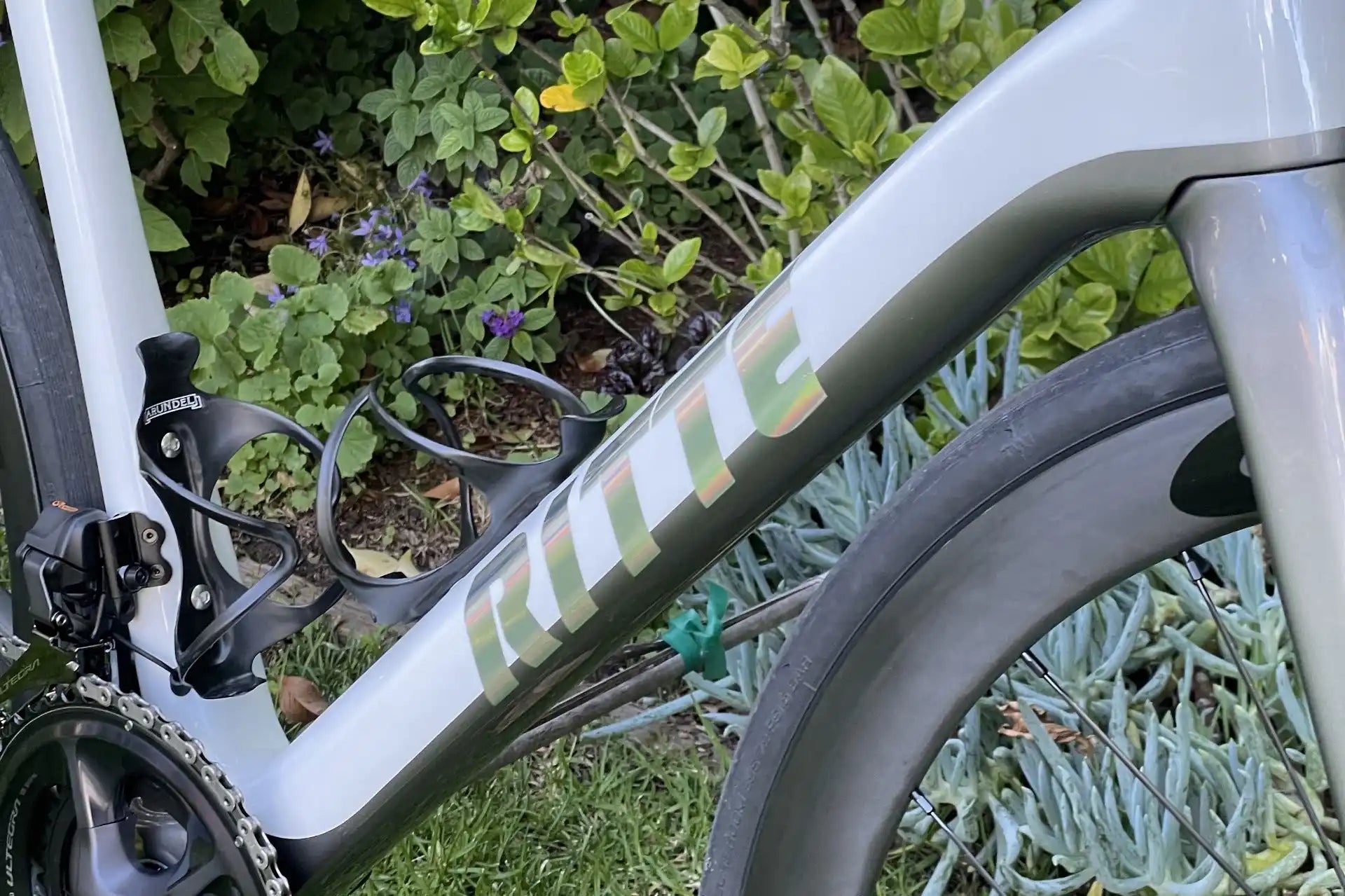 White and green bicycle frame with sleek modern styling.